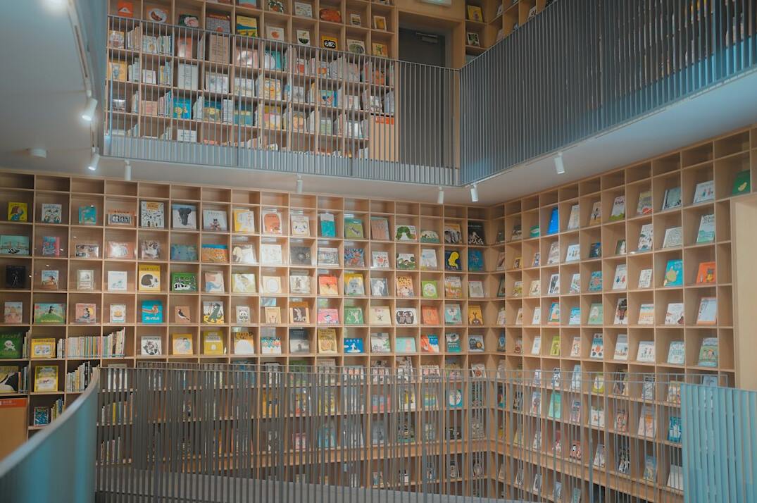 Quiet library interior with tall wooden shelves